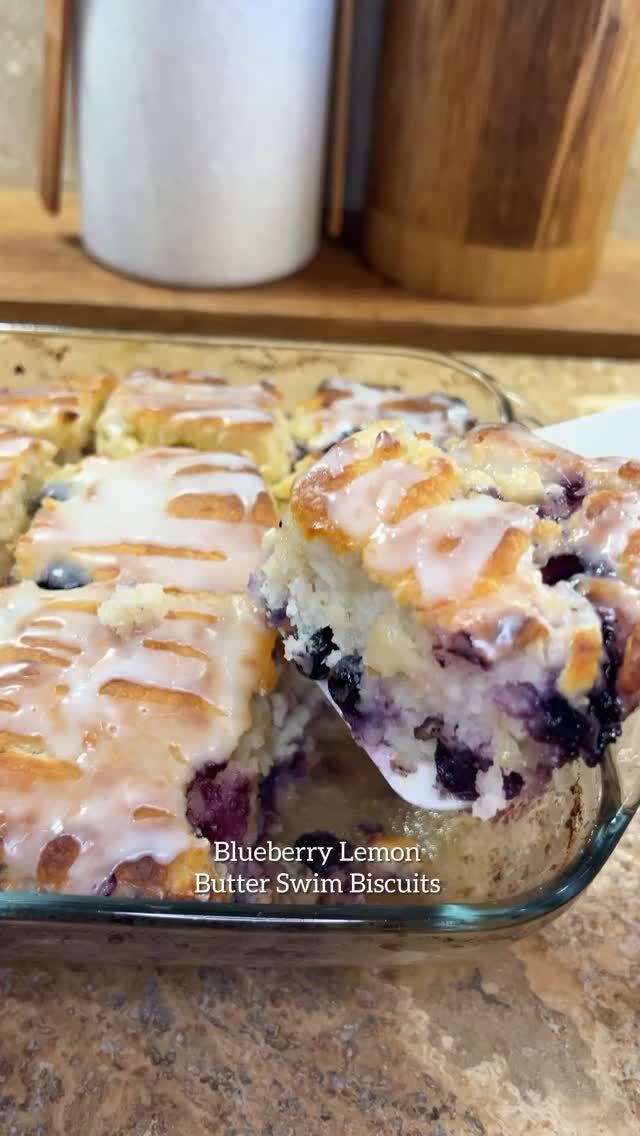 Blueberry Lemon Butter Swim Biscuits 🫐🍋🧈 Soft, buttery, and topped with a lemon glaze: these biscuits are super easy to make! 

This recipe is inspired by my friend’s @glitterandchopsticks I never heard of swim biscuits until she shared her recipe! And now I know why they’re called swim biscuits because they be swimming in butter that somehow magically absorbed by the batter. 😍🏊🏼‍♀️

Ingredients
Biscuits:
1 cup fresh blueberries
Zest of 1 lemon
1/4 cup granulated sugar
2 1/2 cups all-purpose flour
1 tablespoon baking powder
1 teaspoon salt
2 1/4 cups buttermilk
1 teaspoon vanilla extract
1/2 cup butter, melted

Glaze:
1 cup powdered sugar
Juice of 1 lemon

Instructions
Preheat oven to 450°F.
1. Pour the melted butter into a 9x9-inch baking dish.
2. In a large mixing bowl, Combine dry ingredients.
3. Add buttermilk and vanilla extract. Gently stir until just combined. Then stir in blueberries and lemon zest.
4. Pour the batter into the baking dish directly over the melted butter.
5. Use a knife to score the top into 9 squares, cutting all the way through so the butter rises and absorbs into each section.
6. Bake for 30 minutes, or until golden brown and fully cooked in the center.
7. While the biscuits bake, whisk together powdered sugar and lemon juice to make the glaze.
8. Drizzle glaze over warm biscuits and serve.

💙SAVE this one for later and FOLLOW me for more recipes like this!

#blueberryswimbiscuits #swimbiscuits #blueberrybiscuits #baking #recipe